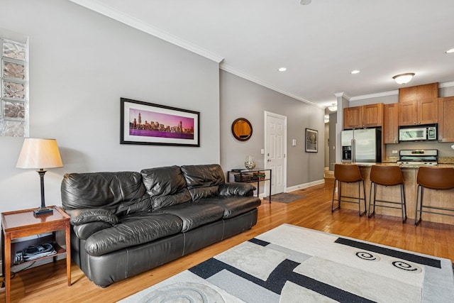 4660 N Winthrop Ave Unit 1N, Chicago, IL 60640 - living room with ornamental molding, light wood-style floors, and recessed lighting