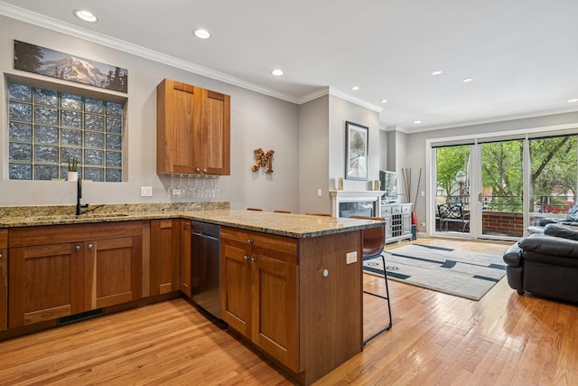 4660 N Winthrop Ave Unit 1N, Chicago, IL 60640 - kitchen with stainless steel dishwasher, open floor plan, light wood-style flooring, a peninsula, and recessed lighting