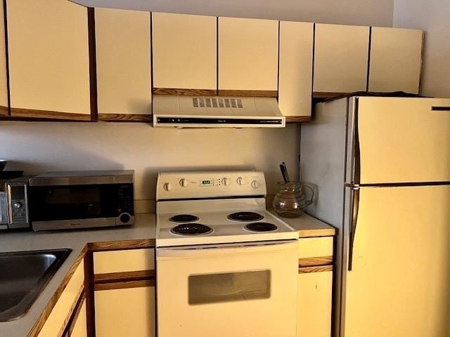 640 S Federal St Unit 603, Chicago, IL 60605 - kitchen with white appliances, range hood, white cabinets, and dark countertops