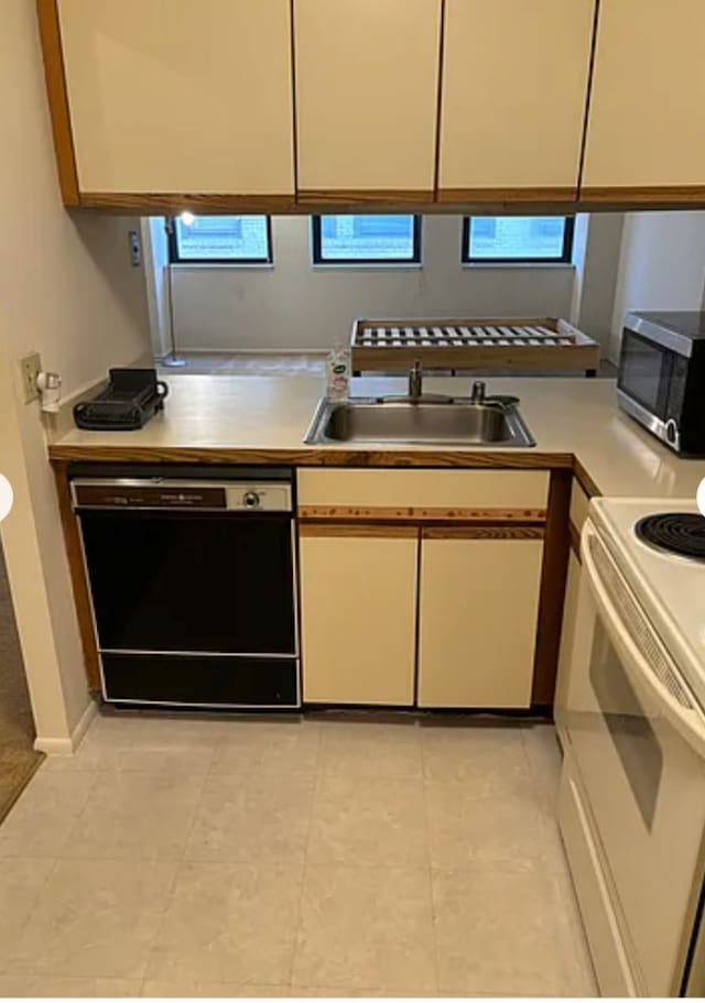 640 S Federal St Unit 603, Chicago, IL 60605 - kitchen featuring stainless steel microwave, black dishwasher, light countertops, electric stove, and white cabinetry