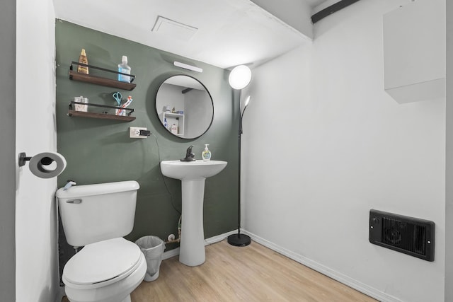 2219 S 60th Ct, Cicero, IL 60804 - half bathroom featuring wood finished floors and toilet