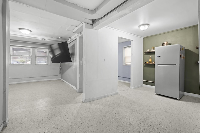 2219 S 60th Ct, Cicero, IL 60804 - below grade area featuring freestanding refrigerator and baseboards