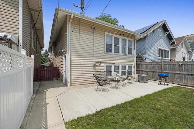 2219 S 60th Ct, Cicero, IL 60804 - rear view of house featuring a patio and a fenced backyard