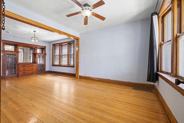 2219 S 60th Ct, Cicero, IL 60804 - unfurnished living room featuring light wood-style flooring and ceiling fan