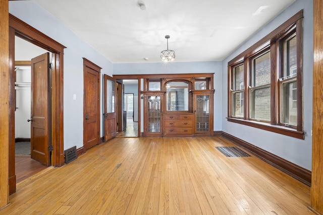 2219 S 60th Ct, Cicero, IL 60804 - entrance foyer featuring light wood-style flooring and a chandelier