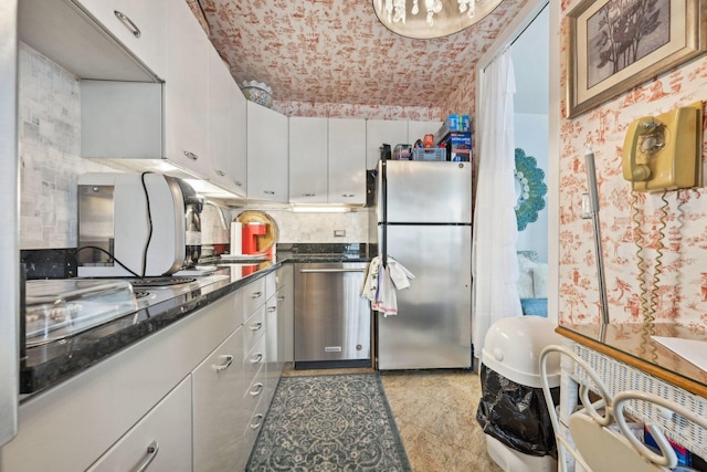 4800 S Chicago Beach Dr Unit 702S, Chicago, IL 60615 - kitchen featuring appliances with stainless steel finishes, white cabinetry, and decorative backsplash