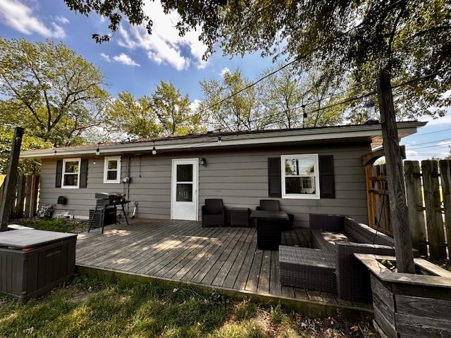 1700 Sunset Dr, Mendota, IL 61342 - rear view of house featuring outdoor lounge area and a wooden deck