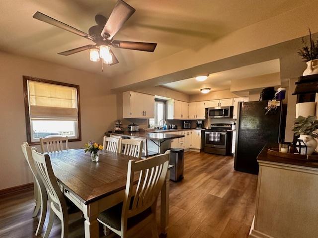 1700 Sunset Dr, Mendota, IL 61342 - dining room featuring dark wood finished floors and ceiling fan