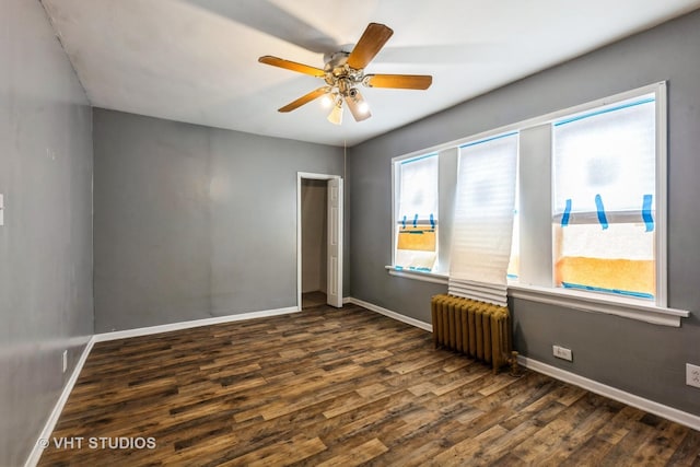32 W 109th Pl, Chicago, IL 60628 - empty room with radiator, dark wood finished floors, and a ceiling fan