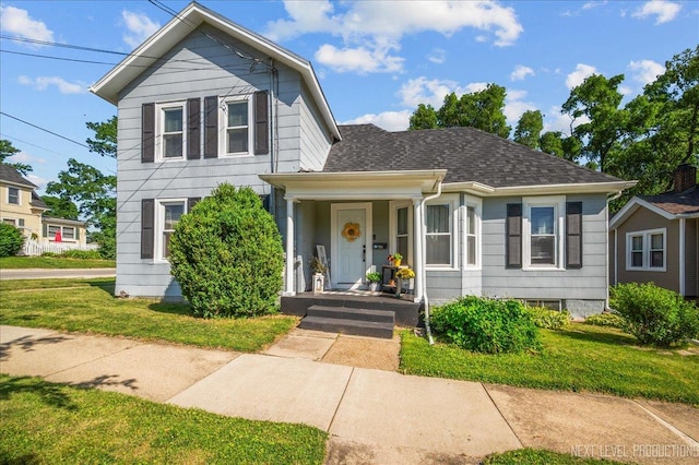 704 Cedar Ave, Saint Charles, IL 60174 - traditional-style house with a front lawn, a shingled roof, and covered porch