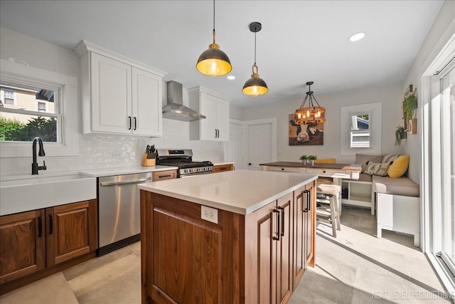 704 Cedar Ave, Saint Charles, IL 60174 - kitchen with appliances with stainless steel finishes, wall chimney exhaust hood, backsplash, light countertops, and recessed lighting