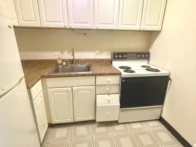2728 N Hampden Ct Unit 103, Chicago, IL 60614 - kitchen featuring white appliances, white cabinets, light flooring, and dark countertops