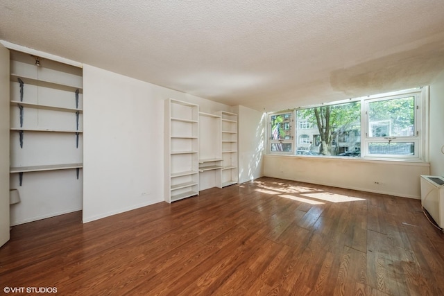 2728 N Hampden Ct Unit 103, Chicago, IL 60614 - unfurnished living room with wood finished floors and a textured ceiling