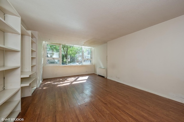 2728 N Hampden Ct Unit 103, Chicago, IL 60614 - empty room featuring dark wood-style flooring and baseboards