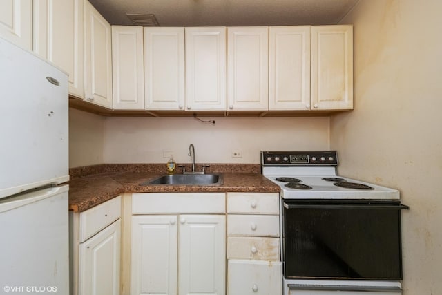 2728 N Hampden Ct Unit 103, Chicago, IL 60614 - kitchen with white appliances, dark countertops, and white cabinets