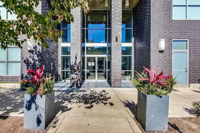 1122 W Catalpa Ave Unit 815, Chicago, IL 60640 - view of exterior entry featuring brick siding
