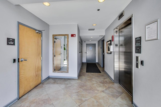 1122 W Catalpa Ave Unit 815, Chicago, IL 60640 - corridor with elevator, recessed lighting, and light tile patterned floors