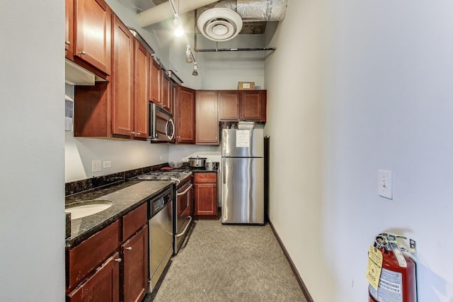 1122 W Catalpa Ave Unit 815, Chicago, IL 60640 - kitchen with stainless steel appliances, light colored carpet, and dark stone countertops