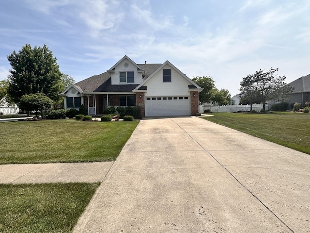 597 Barry Turn, Manteno, IL 60950 - traditional home with concrete driveway, brick siding, and roof with shingles