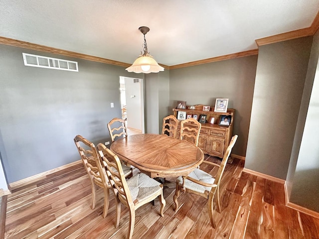 597 Barry Turn, Manteno, IL 60950 - dining area featuring ornamental molding and wood finished floors