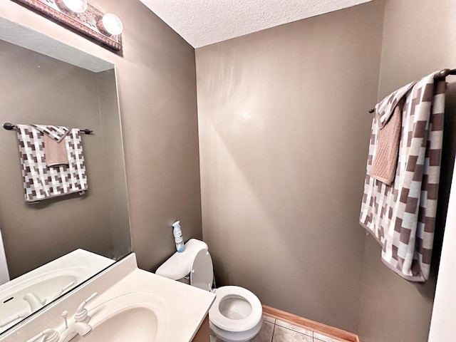 597 Barry Turn, Manteno, IL 60950 - bathroom featuring tile patterned floors, vanity, and a textured ceiling