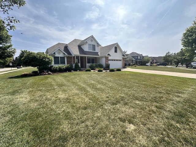 597 Barry Turn, Manteno, IL 60950 - view of front of home with concrete driveway, a front yard, brick siding, and a garage