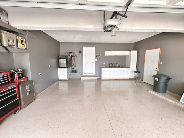 597 Barry Turn, Manteno, IL 60950 - garage with a garage door opener and baseboards