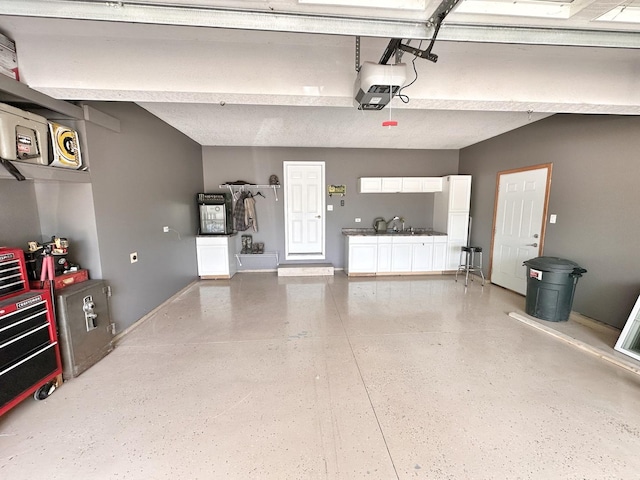 597 Barry Turn, Manteno, IL 60950 - garage with a garage door opener and baseboards