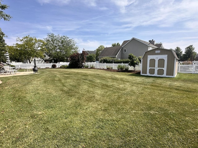 597 Barry Turn, Manteno, IL 60950 - fenced backyard with a storage unit