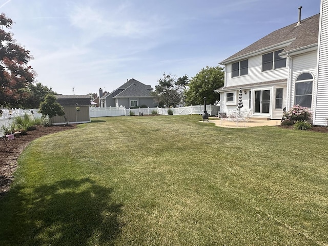 597 Barry Turn, Manteno, IL 60950 - fenced backyard featuring a shed, a patio, and entry steps