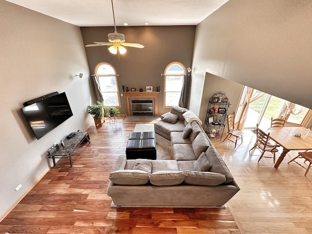 597 Barry Turn, Manteno, IL 60950 - living room with plenty of natural light, a towering ceiling, a ceiling fan, wood finished floors, and recessed lighting