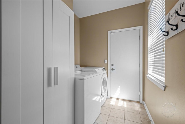 3210 Larrabee Dr, Geneva, IL 60134 - laundry room with washer and dryer, light tile patterned floors, and plenty of natural light