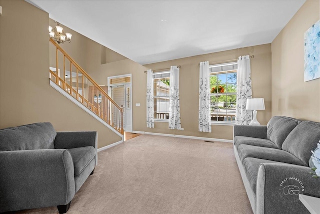 3210 Larrabee Dr, Geneva, IL 60134 - carpeted living area with stairway and a chandelier