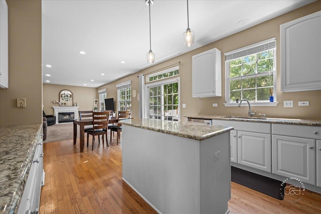 3210 Larrabee Dr, Geneva, IL 60134 - kitchen with light wood-type flooring, healthy amount of natural light, a center island, and recessed lighting