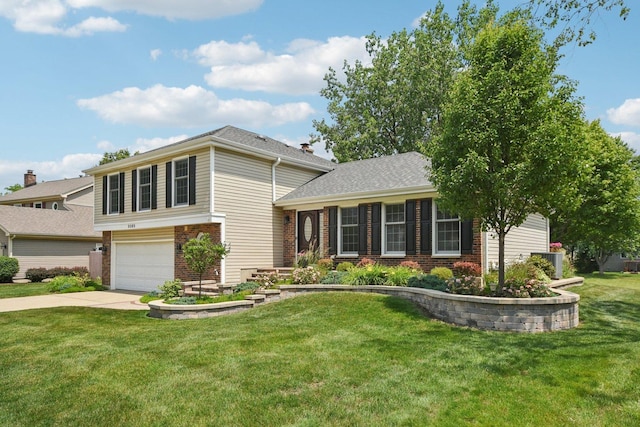 5085 Dukesberry Ln, Hoffman Estates, IL 60010 - tri-level home featuring brick siding, driveway, a garage, and a front yard