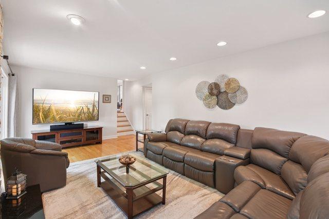 5085 Dukesberry Ln, Hoffman Estates, IL 60010 - living area with recessed lighting, light wood finished floors, and stairway