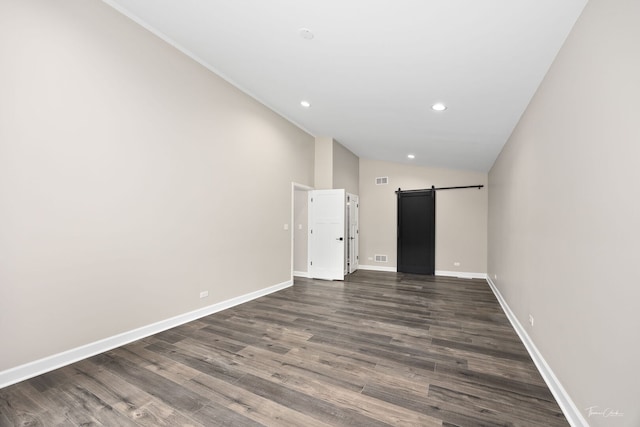9704 Captains Dr, Algonquin, IL 60102 - unfurnished room featuring a barn door, dark wood-style flooring, recessed lighting, and lofted ceiling
