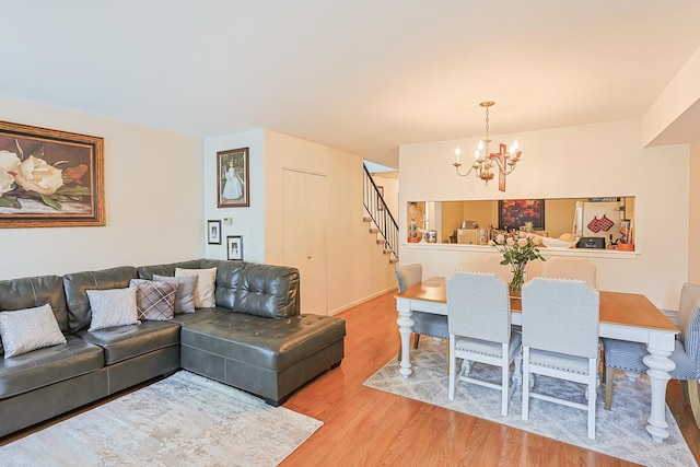 377 Grissom Ct, Hoffman Estates, IL 60169 - living area with a chandelier, light wood finished floors, and stairway