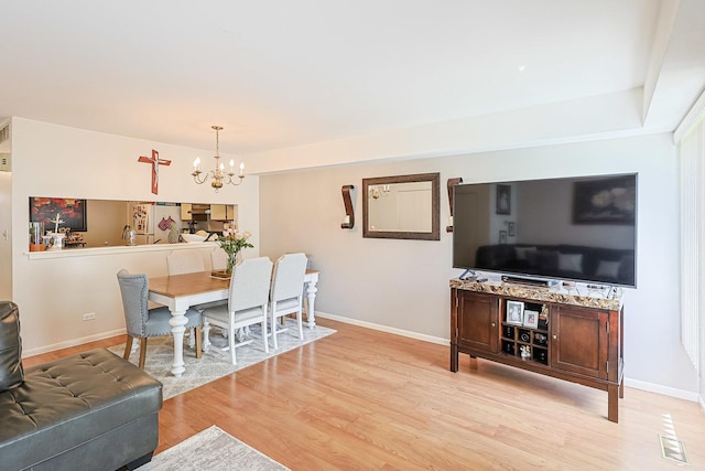377 Grissom Ct, Hoffman Estates, IL 60169 - dining area with a chandelier and light wood-type flooring