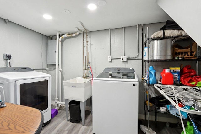 2023 Kristan Ave, North Chicago, IL 60064 - laundry room with washing machine and dryer, wood finished floors, and electric panel