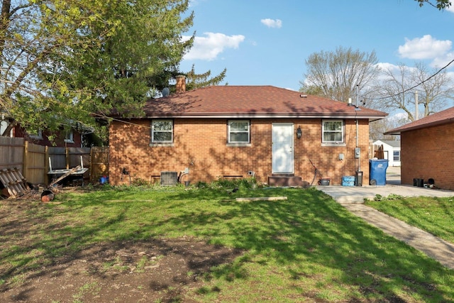 2023 Kristan Ave, North Chicago, IL 60064 - rear view of property with brick siding, entry steps, and a chimney