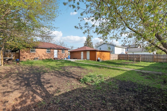 2023 Kristan Ave, North Chicago, IL 60064 - fenced backyard featuring an outbuilding