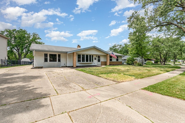 208 Webster Ln, Schaumburg, IL 60193 - view of front of property featuring concrete driveway, a chimney, and brick siding