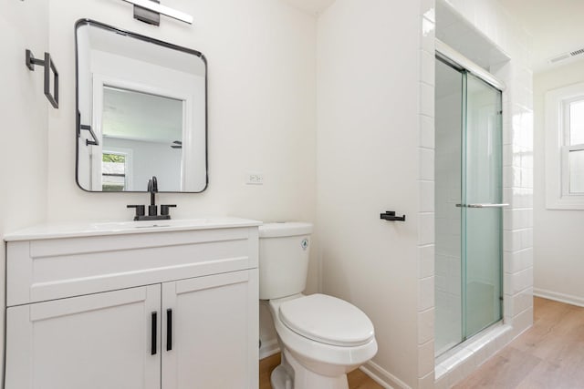 208 Webster Ln, Schaumburg, IL 60193 - full bathroom with wood finished floors, healthy amount of natural light, and a shower stall