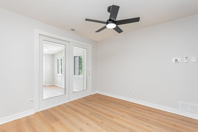 208 Webster Ln, Schaumburg, IL 60193 - spare room with light wood finished floors and ceiling fan