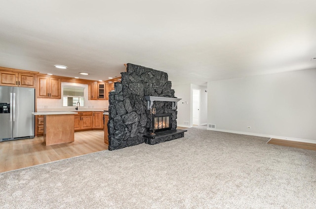 208 Webster Ln, Schaumburg, IL 60193 - unfurnished living room featuring light colored carpet, a fireplace, and recessed lighting