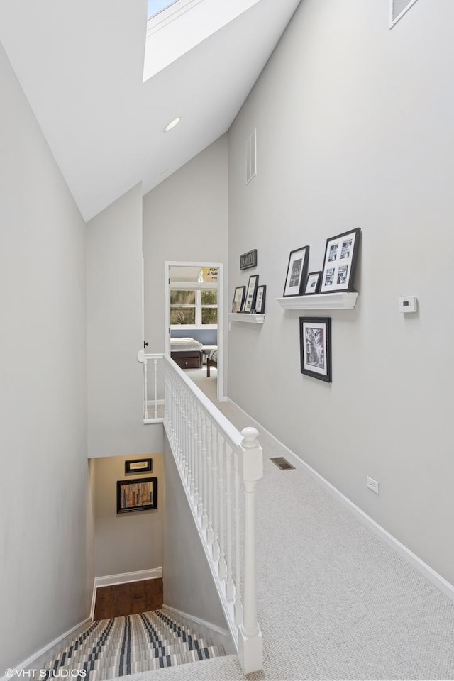 3444 N Hamilton Ave, Chicago, IL 60618 - staircase with a skylight and high vaulted ceiling
