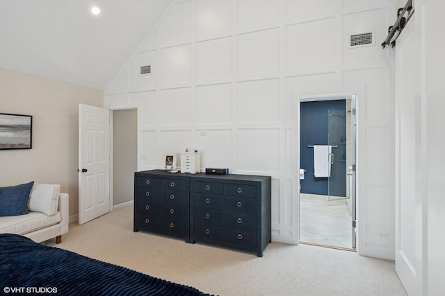 3444 N Hamilton Ave, Chicago, IL 60618 - bedroom with a decorative wall, vaulted ceiling, light carpet, and ensuite bath