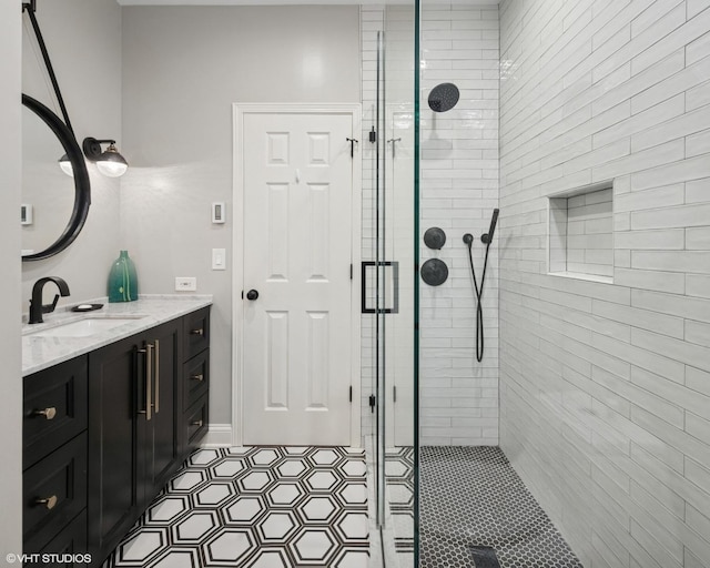 3444 N Hamilton Ave, Chicago, IL 60618 - bathroom with a shower stall, vanity, and tile patterned floors