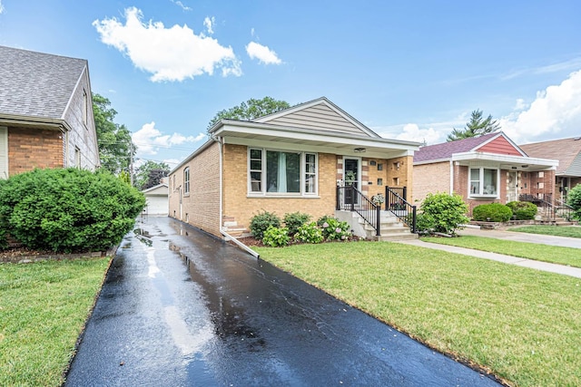 9226 S Utica Ave, Evergreen Park, IL 60805 - view of front facade with brick siding, a front lawn, and an outbuilding